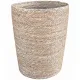 Open rattan laundry basket in a cylindrical shape and a textured, rustic finish.