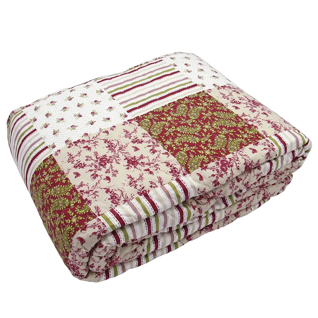 Gevouwen roze bedsprei met patchwork bloemen- en paisleyprint.
