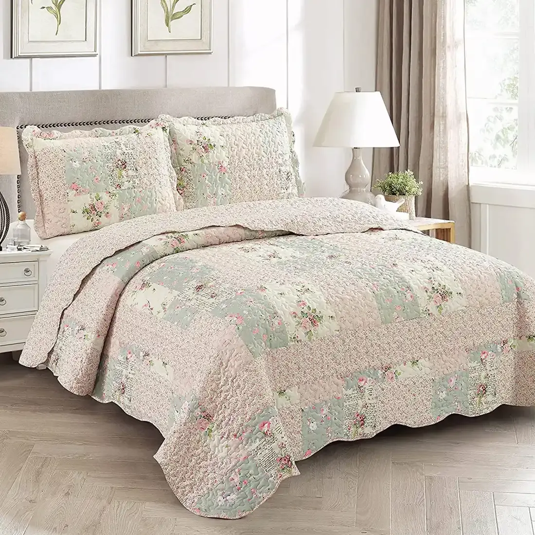 Elegant bedroom with a Rosebud floral quilt set on bed, matching pillows, and classic decor.