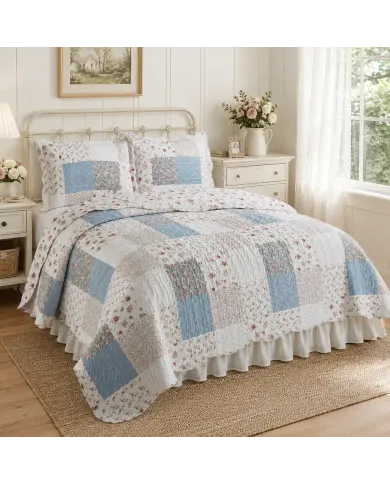 Cozy bedroom featuring a floral bedspread in a patchwork cottage look, complemented by matching pillows.