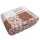 Folded Paisley Delight quilt, showcasing patchwork floral and paisley prints.