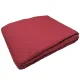 Folded red bedspread, showcasing a double diamond pattern.