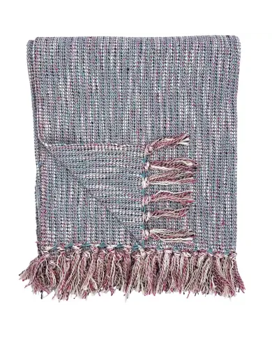 A folded woven cotton throw blanket with tassels on the edges.