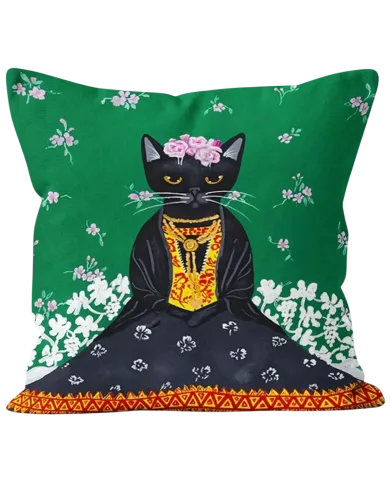 A green cat cushion featuring a Frida Kahlo style black cat adorned with flowers and traditional clothes.