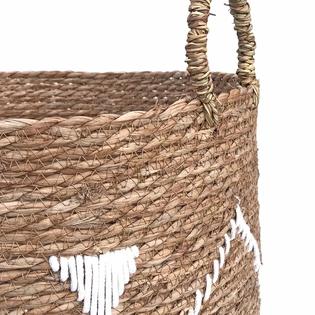 Close up of the raffia handles on the embroidered seagrass laundry basket.