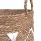 Close up of the raffia handles on the embroidered seagrass laundry basket.