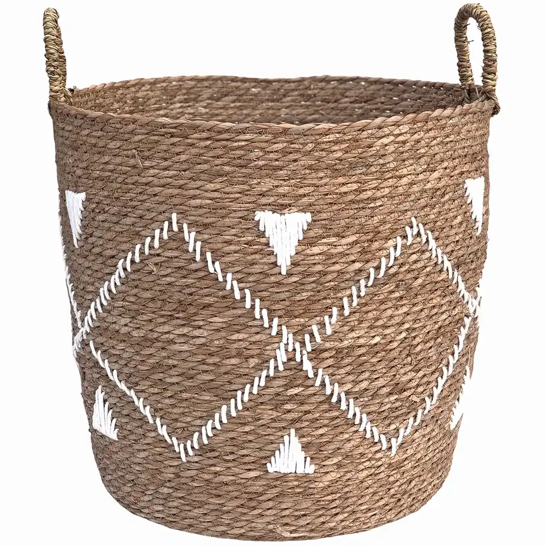 Laundry basket handcrafted from seagrass with white embroidered geometric patterns and sturdy side handles.