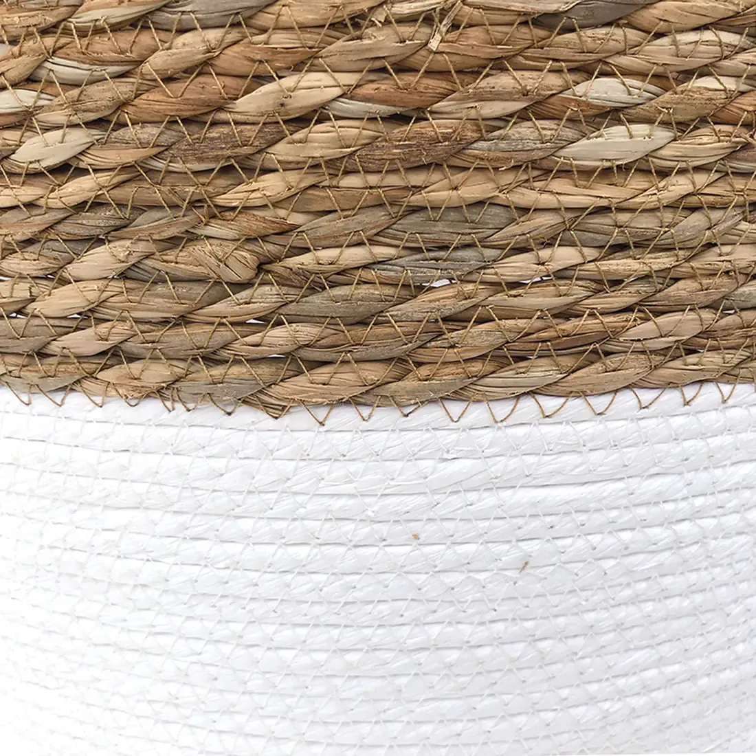Close up detail of the two-tone seagrass laundry basket.