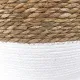 Close up detail of the two-tone seagrass laundry basket.