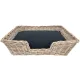 A rattan dog basket with a removable black cushion, designed for comfort and style.