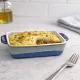 Shepherd's pie served in a reactive glaze oven dish, surrounded by olive oil.