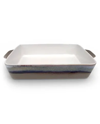 A rectangular oven dish with a glossy white interior and a reactive glaze exterior.