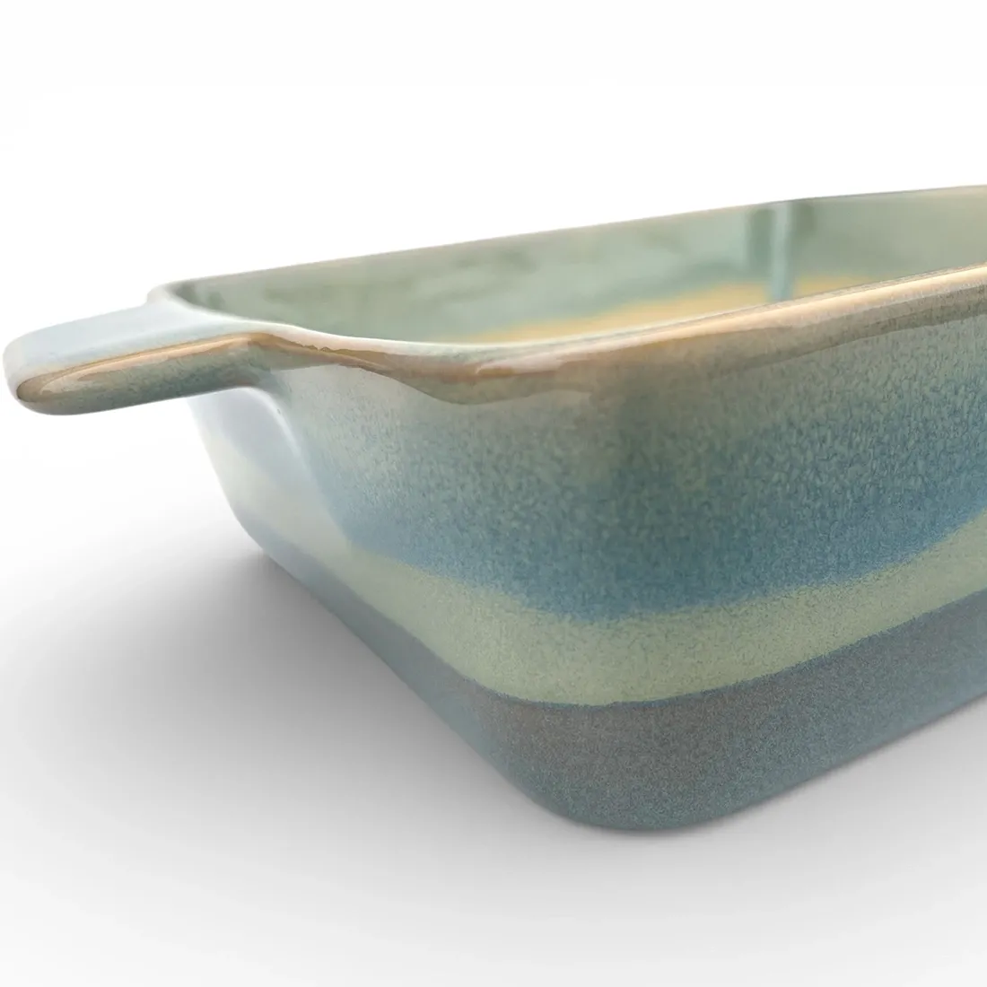 A close-up of a square oven dish high-lighting the reactive glaze finish.