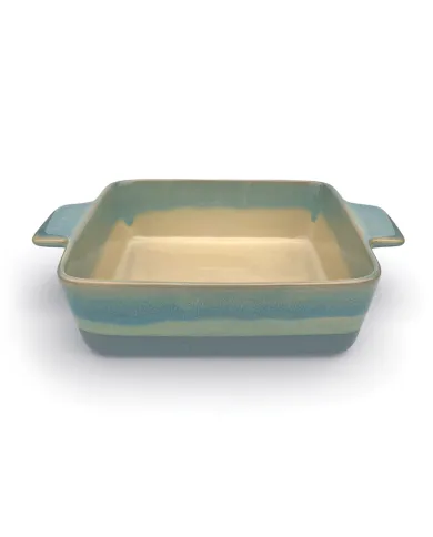 A square oven dish in a reactive glaze of blue hues, featuring two curved handles and a smooth interior.