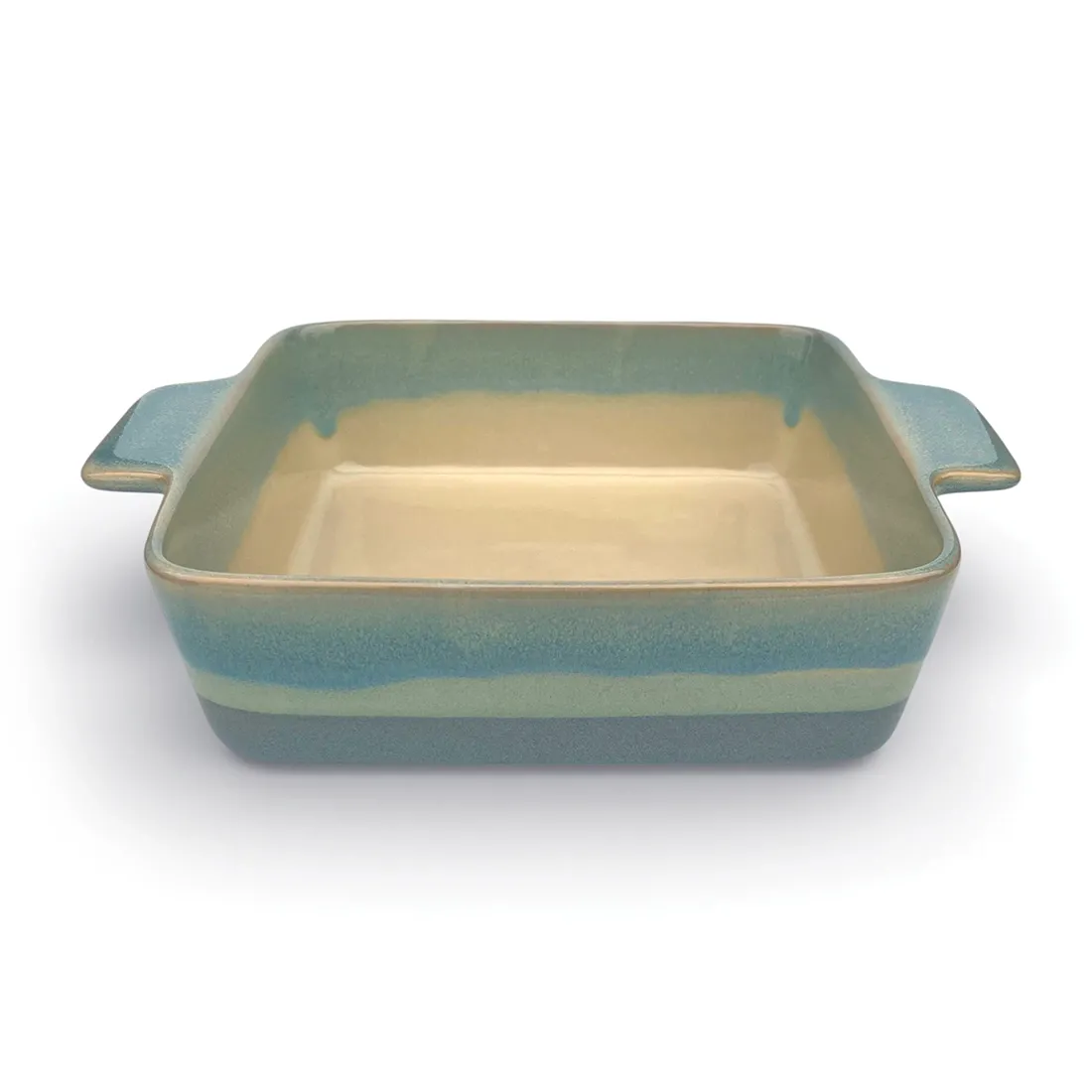 A square oven dish in a reactive glaze of blue hues, featuring two curved handles and a smooth interior.