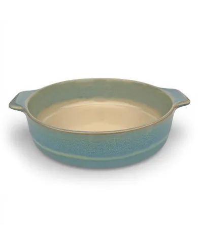 A round oven dish in a reactive glaze of blue hues, featuring two curved handles and a smooth interior.