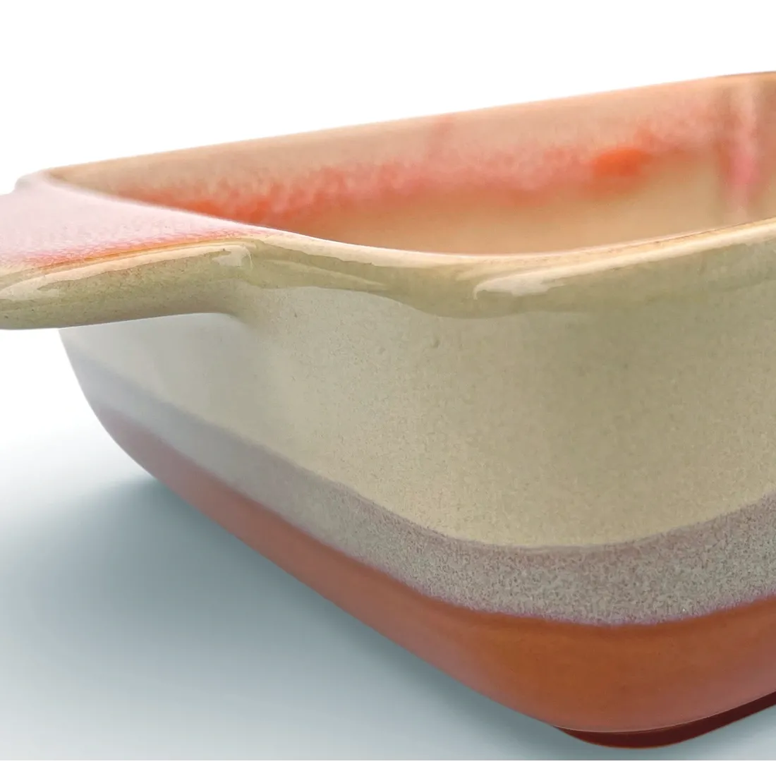 A close-up of a square oven dish high-lighting the reactive glaze finish.
