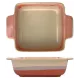 A square oven dish with a terracotta and cream gradient, featuring two handles for easy handling.