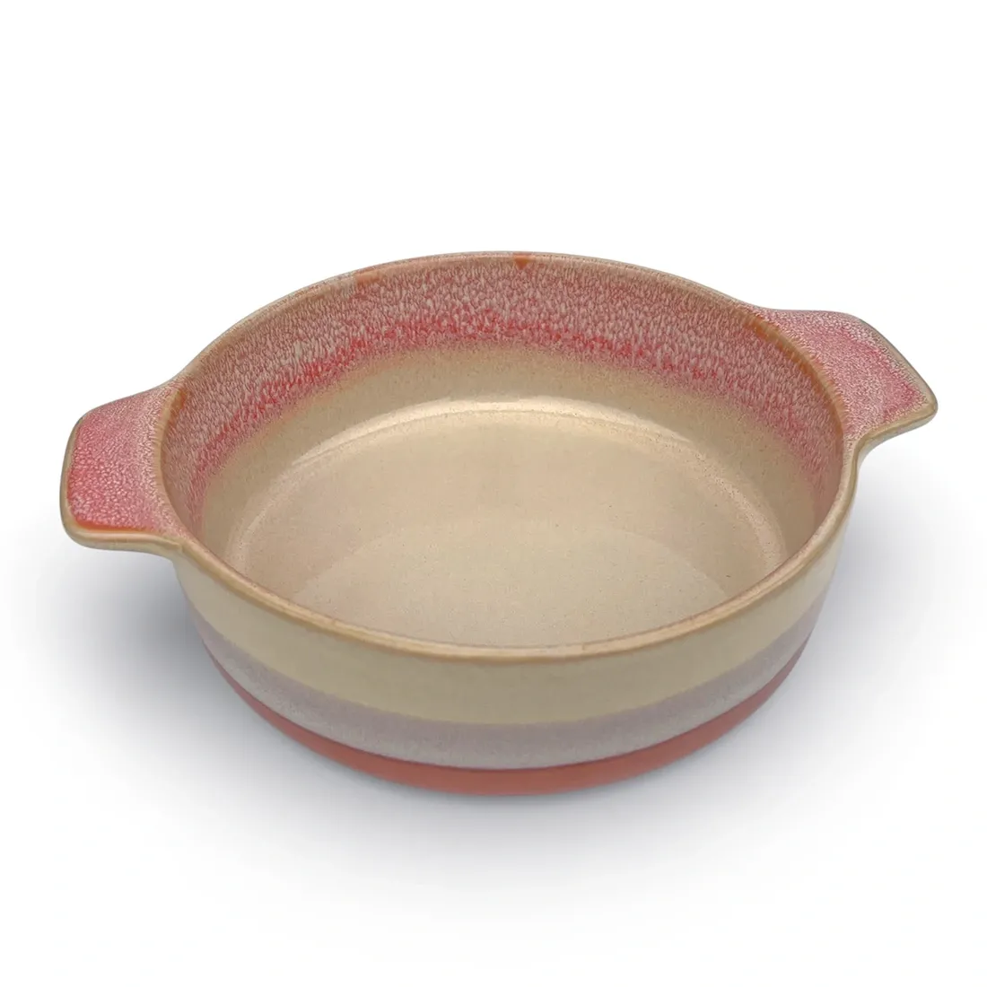 A round oven dish in a reactive glaze of terracotta hues, featuring two curved handles and a smooth interior.