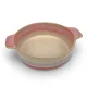 A round oven dish in a reactive glaze of terracotta hues, featuring two curved handles and a smooth interior.