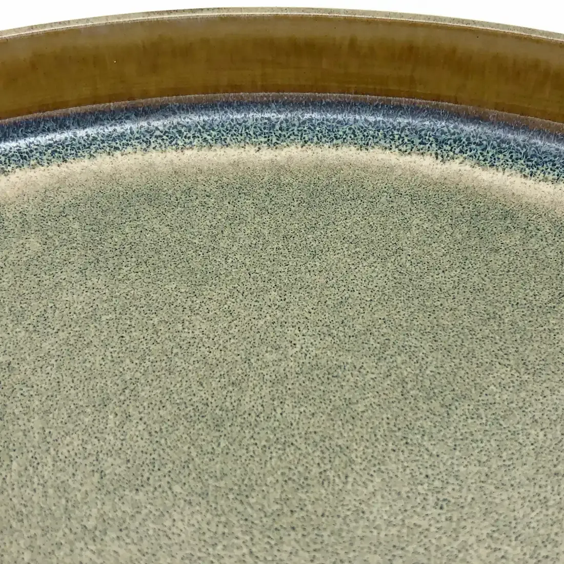 A close-up of the reactive glaze detail of the bohemian dinner plate.