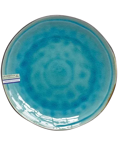 A round, reactive glazed ceramic dinner plate with a turquoise crackle pattern effect.