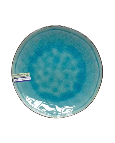 A round, reactive glazed ceramic side plate with a turquoise crackle pattern effect.