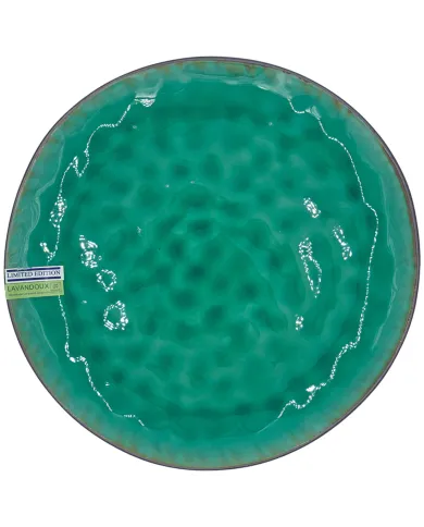 A round, reactive glazed ceramic dinner plate with a green crackle pattern effect.