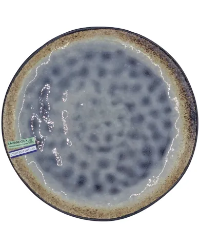 A round, reactive glazed ceramic dinner plate with a lilac surface and a brown edge.