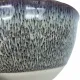 Close-up of a ceramic ramen bowl, featuring a gradient of blue to grey with a speckled reactive glaze finish.