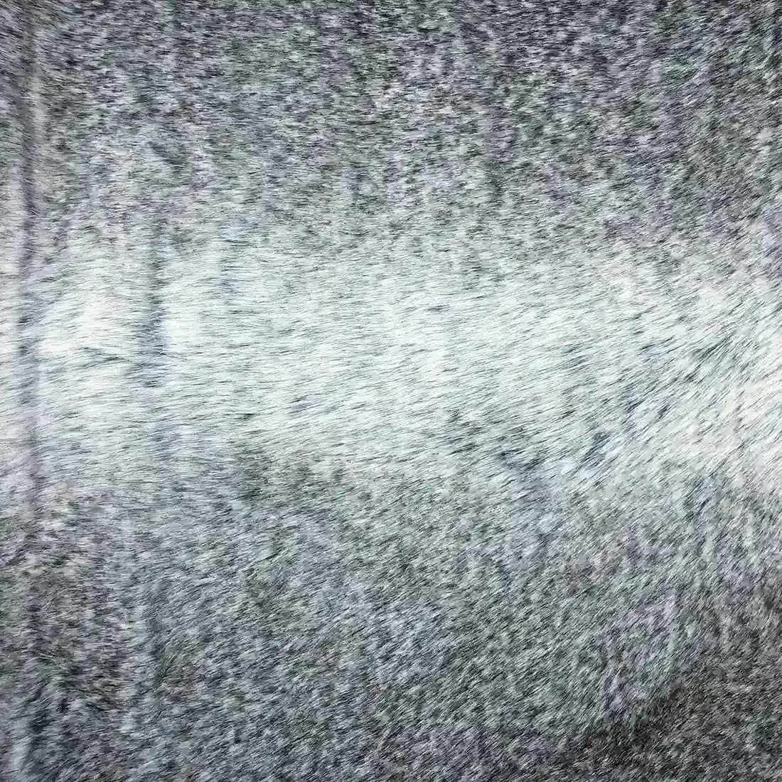Close up of the soft grey faux fur throw blanket.