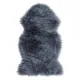 Classically shaped grey sheepskin rug made of soft and luxurious faux fur.