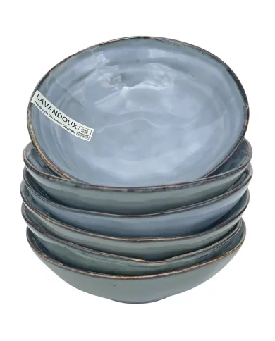 Stapel van zes elegante tapas schaaltjes blauw gekleurd met een glanzende afwerking en een rustieke rand.