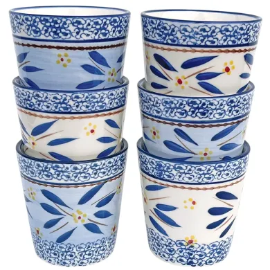 A coffee mug set of six decorative ceramic mugs featuring floral and leaf patterns in blue and white.