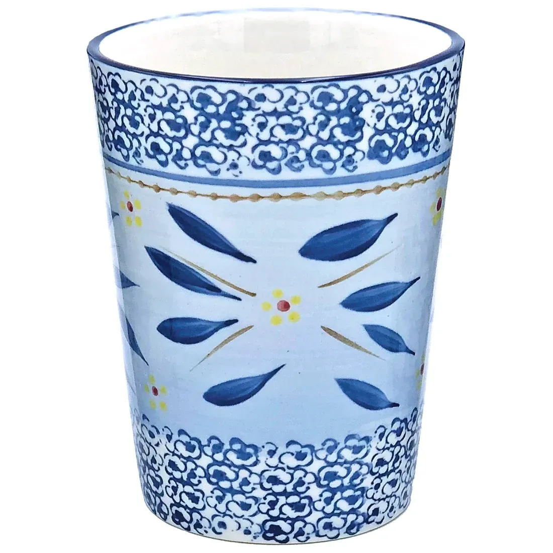 A handcrafted tall ceramic mug featuring a blue floral design and intricate border.