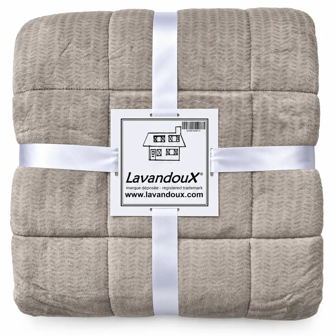 Folded beige quilted blanket secured with white ribbons and labeled Lavandoux.