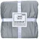 Folded light grey velvet bedspread secured with white ribbons and labeled Lavandoux.