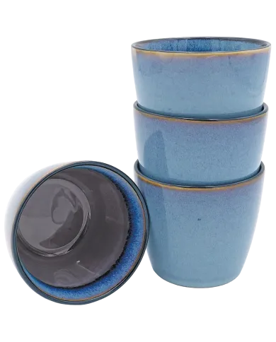 Blue cappuccino mugs stacked with one inverted to show mauve interior.