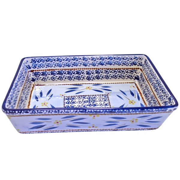 Rectangular ceramic oven dish with intricate blue and yellow floral patterns on a white background.