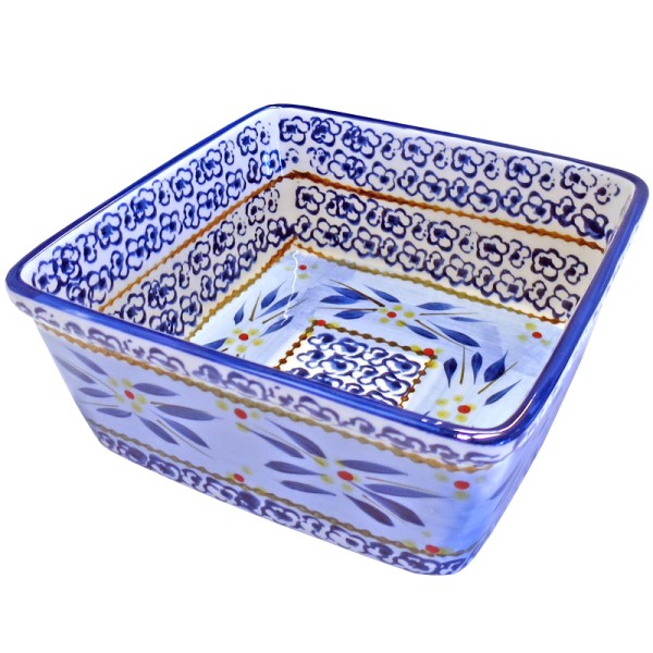 Square ceramic oven dish with blue floral patterns and brown rim on a white background.