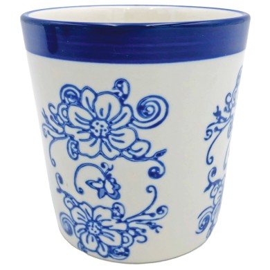 A white ceramic coffee mug adorned with intricate blue floral designs and swirls along its exterior.